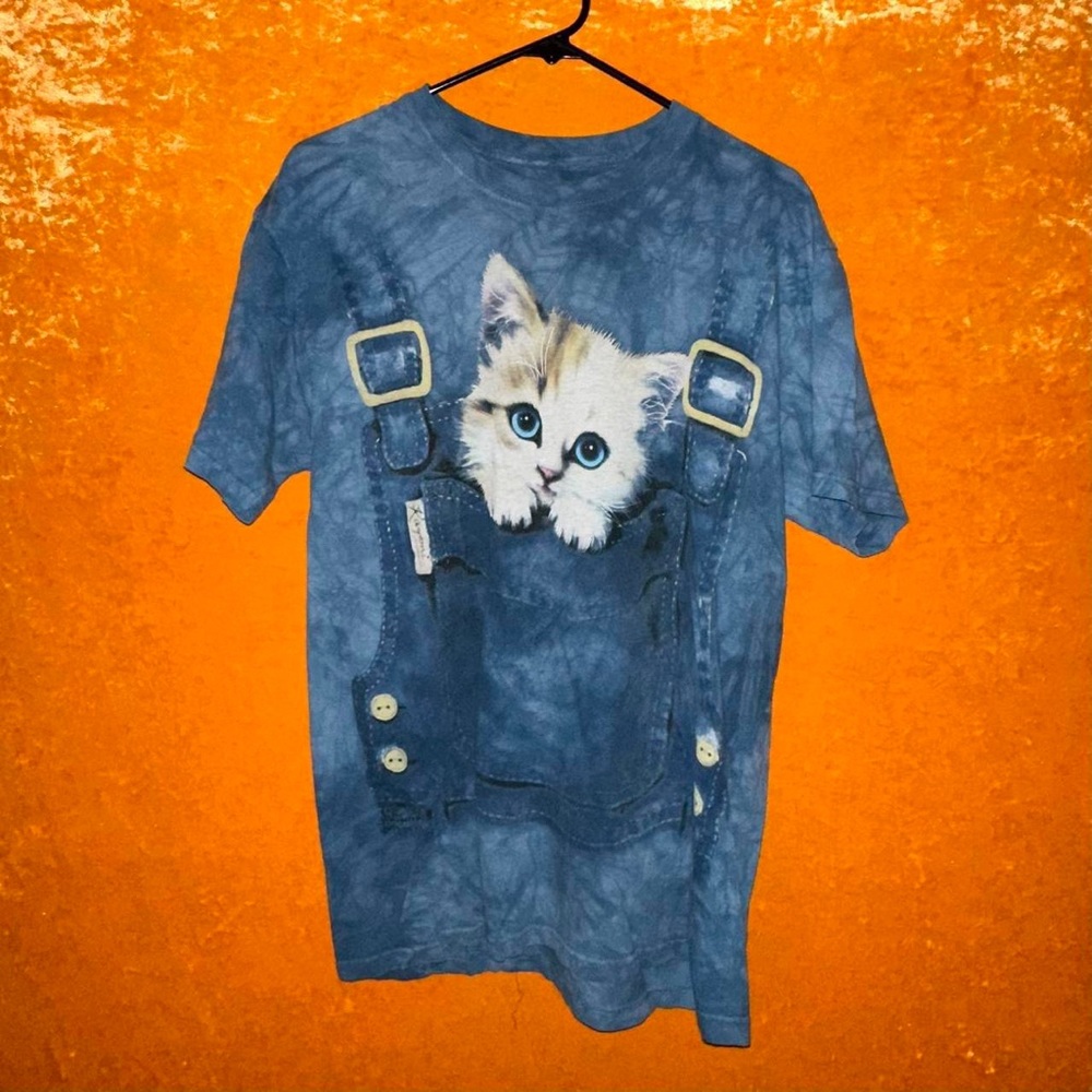 the mountain cat in denim overalls all over blue tie dyed shirt
